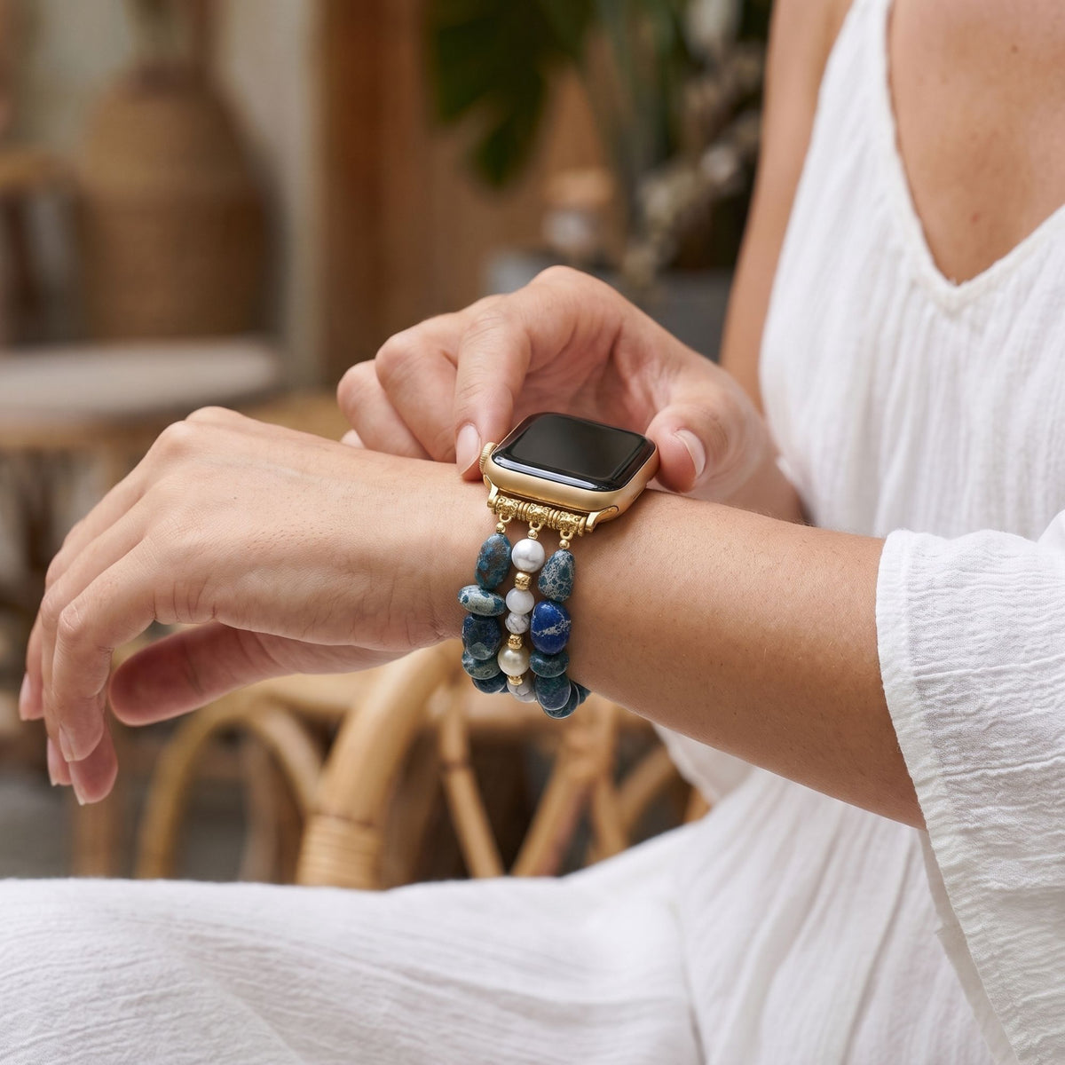 Woman wearing the Still Waters sea sediment jasper Apple Watch strap